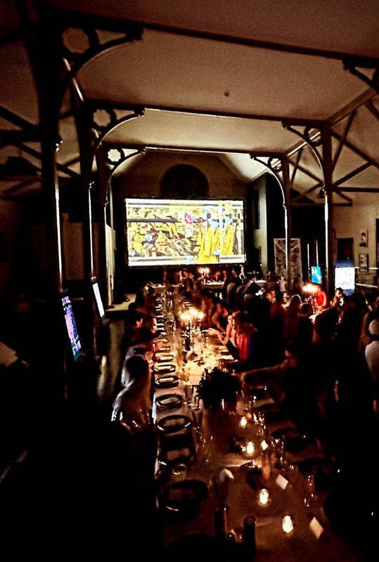 A candlelit dinner inside a historic gothic church.