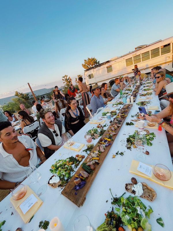 A long table set in the desert.