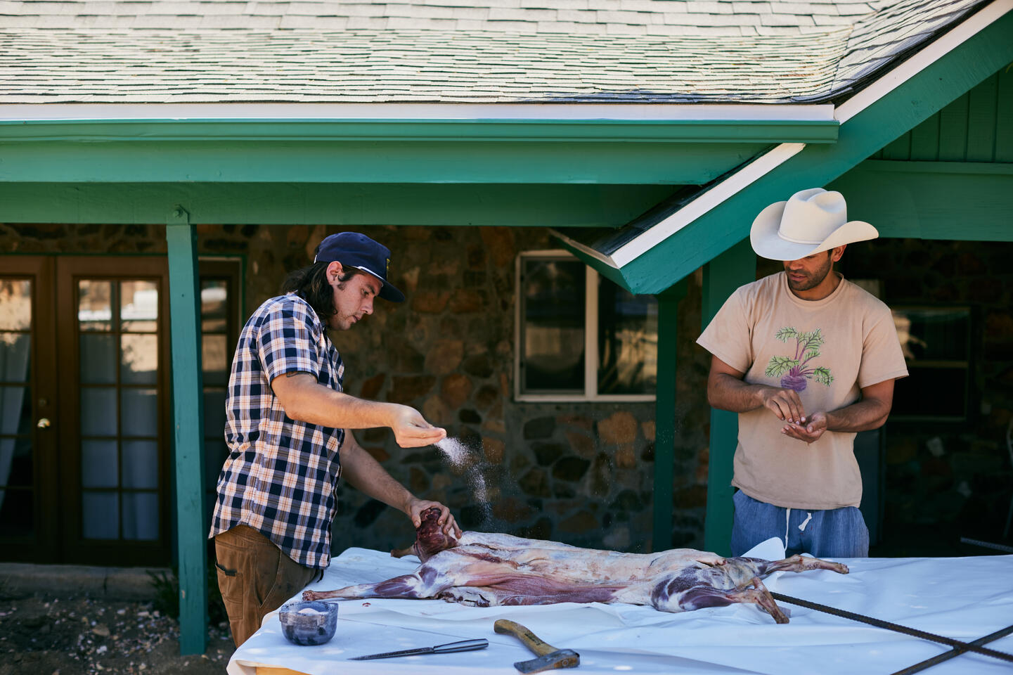 Early morning in the desert, preparing one of the lambs with Chef Thomas of Malibu.