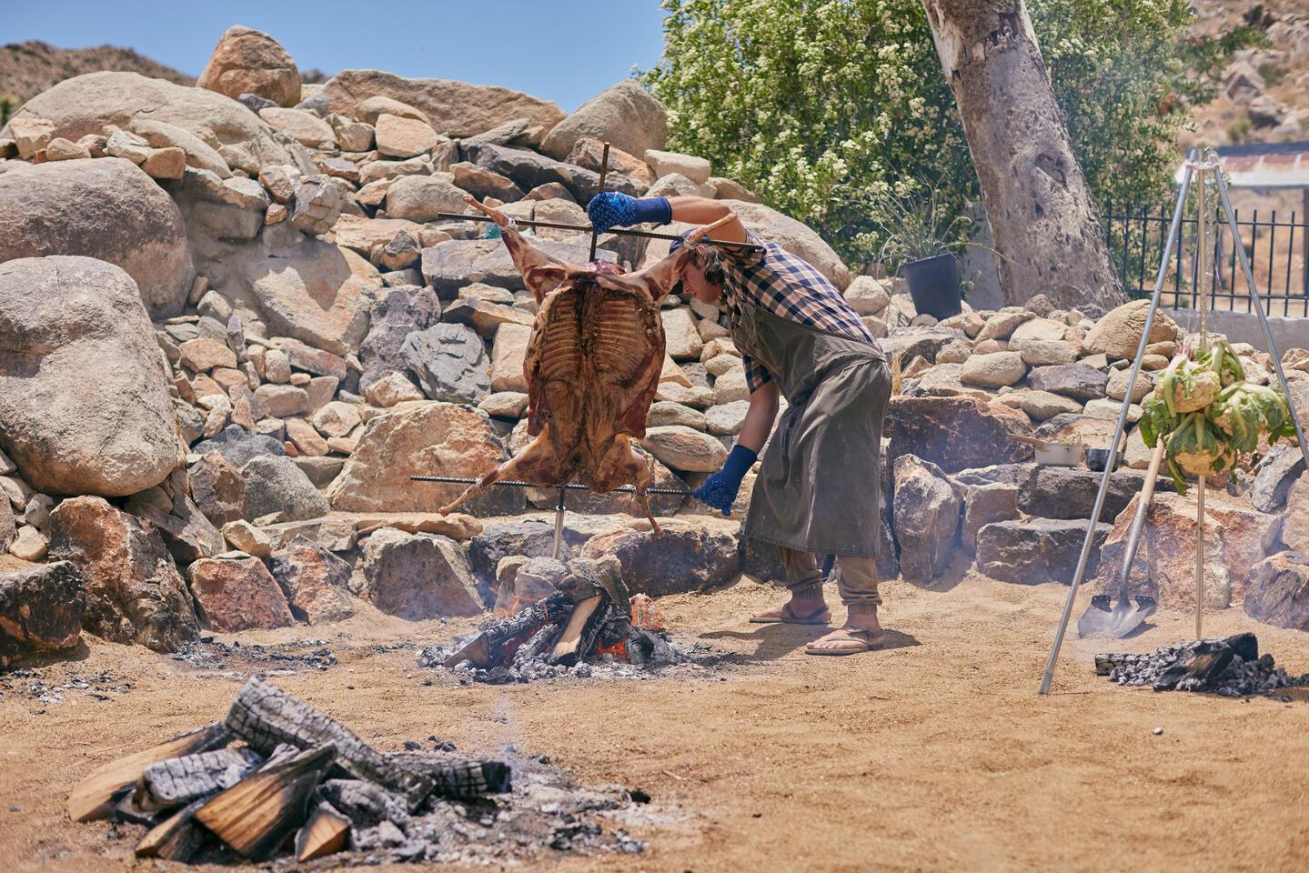 Chef Thomas preparing a full lamb on the tradition iron cross.